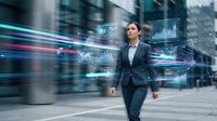 Professional businessman walking through modern city with digital data analytics interfaces and holographic charts displaying financial information in motion blur urban environment.