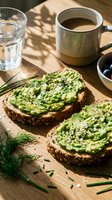 Healthy avocado toast with herbs and feta cheese on wooden board with coffee and water glass for nutritious breakfast or brunch meal.