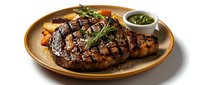 Grilled ribeye steak with herb garnish and chimichurri sauce on golden plate, premium beef dinner with rosemary and roasted vegetables for restaurant menu.