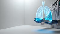 Doctor holding holographic lungs projection for respiratory health diagnosis and medical technology consultation in modern healthcare facility.
