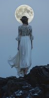 Woman in flowing white gown standing on rocky outcrop facing full moon in twilight sky. Surreal, dreamy nighttime scene for fantasy, editorial, and conceptual design projects.