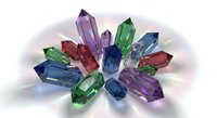 Colorful gemstone collection featuring emerald, sapphire, amethyst and ruby crystals arranged in circular pattern on white background for jewelry design.