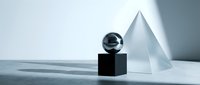Minimalist geometric composition with black sphere on cube and glass pyramid creating elegant shadows on white surface for modern design projects.