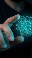 Hand holding glowing turquoise holographic geometric cube pattern against dark background. Futuristic technology visualization for digital innovation, software development, and data science concepts.