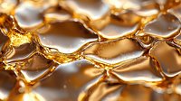 Golden honeycomb cells in extreme macro photography showing liquid honey texture and natural geometric pattern with light reflections and amber glow.