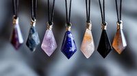 Crystal pendants on black cord necklaces featuring amethyst, lapis lazuli, rose quartz, and other healing stones in geometric shapes against blurred background.
