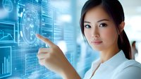 Young Asian businesswoman pointing at digital screen with financial charts and business analytics data, working in modern corporate office environment.