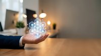 Businessman hand holding glowing digital network connection icon in modern office environment representing technology innovation and connectivity solutions.