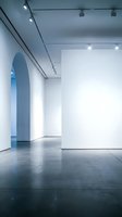 Modern minimalist gallery interior with white walls, track lighting and polished concrete floors for contemporary art exhibitions and cultural events.
