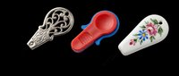 Decorative spoon collection featuring ornate silver, red and blue silicone, and floral ceramic designs isolated on transparent background. Ready for clipart, print-on-demand, sublimation, t-shirt designs, and kitchen product mockups.