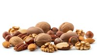 Mixed nuts and seeds collection including walnuts, almonds, hazelnuts and pecans isolated on white background for healthy snacking and cooking ingredients.