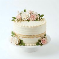 Elegant two-tier wedding cake with cream frosting, fresh pink and white roses, baby's breath, and green foliage. Isolated on white background, perfect for bakery, wedding planning, and celebration design projects.