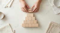 Business professional building wooden blocks pyramid with trust concept for leadership development and team building success strategy.