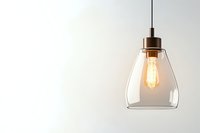 Modern glass pendant lamp with glowing vintage Edison bulb against white wall, creating warm minimalist lighting atmosphere for interior design.