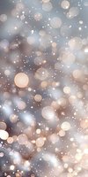 Dreamy bokeh lights on soft gray background with glowing particles and circles creating magical festive atmosphere for holiday designs and celebrations.