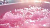 Pink water splash with glowing bokeh effect and droplets creating dynamic motion against blurred background, suitable for cosmetic and spa advertising.