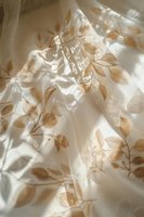 Soft natural light creates delicate leaf shadows on flowing white fabric, evoking peaceful morning atmosphere for home decor and wellness concepts.