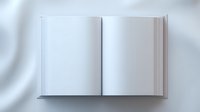 Open blank white book with empty pages on light background, mockup for design presentation and branding projects, top view layout.