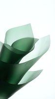 Abstract green curved shapes flowing upward on white background creating modern minimalist composition for contemporary design projects.