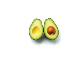 Fresh avocado halves with pit isolated on white background for healthy cooking and nutrition designs.