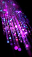 Glowing pink and blue fiber optic lights creating magical bokeh effect against black background, abstract technology concept with bright illuminated particles.
