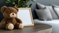 Brown teddy bear with blank wooden frame on coffee table in modern living room interior with gray sofa and green plant for home decor and children concepts.