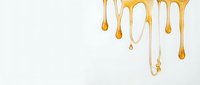 Dripping golden honey flows down from top on white isolated background, ready for food packaging, culinary design, and commercial use.