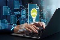 Business professional using laptop with digital innovation concept featuring glowing lightbulb and document icons for automated workflow solutions.