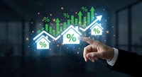 Businessman hand pointing at glowing financial growth charts with percentage symbols and upward arrows showing business success and profit increase.