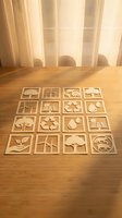 Wooden eco-friendly icons arranged on table featuring renewable energy, nature and sustainability symbols for environmental design projects.