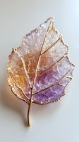 Crystal leaf brooch with gold-plated edges featuring gradient colors from orange to purple on white isolated background, suitable for jewelry design and decoration.