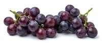 Fresh purple grapes cluster isolated on white background for healthy eating, wine making, fruit design projects and culinary presentations.