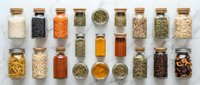 Assorted dried herbs, spices, grains and legumes in glass jars with cork lids arranged on white background. Cooking ingredients for food preparation and recipe development.