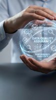 Businessman hands protecting holographic sphere with data quality assurance and performance analytics icons for digital transformation concepts.