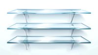 Empty glass shelves with soft shadows on white wall, modern minimalist display for retail, home interior or exhibition space, transparent acrylic or crystal surfaces.