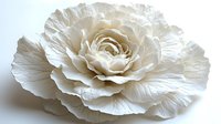 Delicate white paper flower with intricate layered petals creating depth and texture against neutral background, showcasing detailed craftsmanship and botanical artistry.