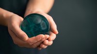 Hands holding glowing teal globe with digital network connections, representing global communication, technology innovation, and worldwide business connectivity for corporate concepts.