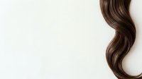 Long wavy brunette hair isolated on white background, ready for hair care product marketing, salon advertising, and beauty design projects.