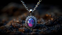 Vintage silver pendant with mystical opal gemstone on delicate chain against dark textured background, glowing pink and purple colors create magical atmosphere.