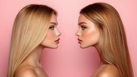 Two blonde women with red lips and glowing skin facing each other in profile against pink background, showcasing natural beauty and professional makeup artistry.