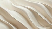 Elegant cream-colored silk fabric with soft wavy folds creating gentle curves and shadows against light background, luxurious textile surface with flowing lines.