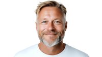 Mature Caucasian man with gray beard and styled blonde hair wearing white t-shirt smiling confidently at camera against white background, isolated portrait.