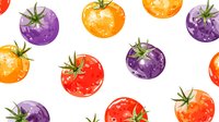 Colorful heirloom tomatoes in red, orange and purple varieties with green stems scattered on white background for culinary and gardening designs.