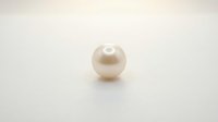 Single lustrous cream pearl sphere isolated on white background, suitable for jewelry design, luxury branding, and cosmetic product packaging applications.