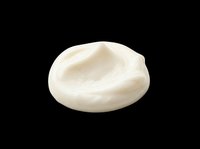 Creamy white cosmetic cream smear isolated on transparent background, ready for beauty product design, stickers, print on demand, and T-shirt use.