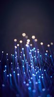 Blue fiber optic cables with glowing lights creating abstract technology network background for digital communication and data transfer concepts.