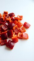 Fresh diced beetroot pieces on white background, raw organic vegetable cubes for healthy cooking and meal preparation isolated for culinary design use.