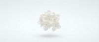 White paper snowflake cutout floating on clean background for winter holiday crafts and seasonal decorations.