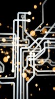 Abstract circuit board pattern with glowing golden light particles flowing through white interconnected pathways on dark background, representing technology, data transfer, and digital connectivity for tech industry applications.