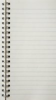 Open spiral notebook with blank lined pages and metal wire binding for writing notes and planning tasks.